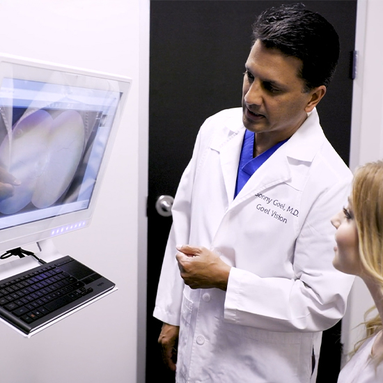 Dr. Goel explaining how SMILE eye surgery works to a patient during a free consultation.