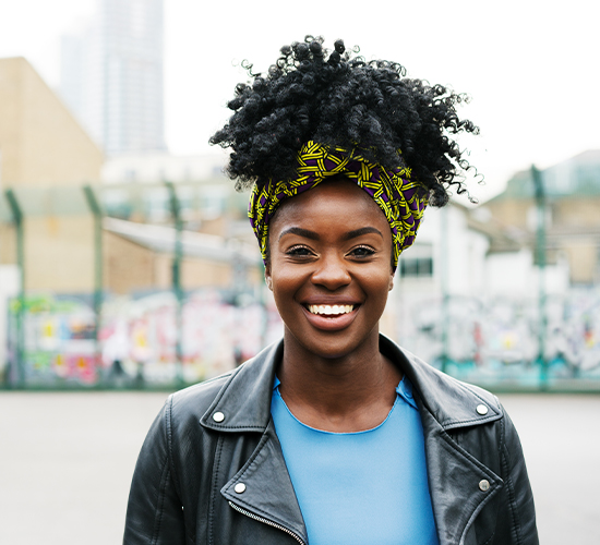 Patient smiling after successful EVO ICL procedure with clearer vision, emphasizing their positive experience.