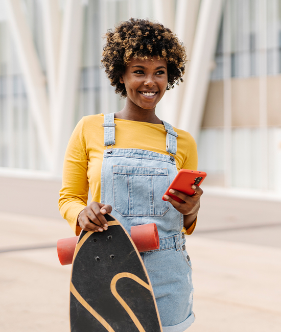 Patient recovering after SMILE eye surgery, enjoying a skateboard ride.