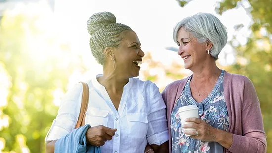 Two women enjoying the outdoors, representing a life free from cloudy vision after cataract surgery.
