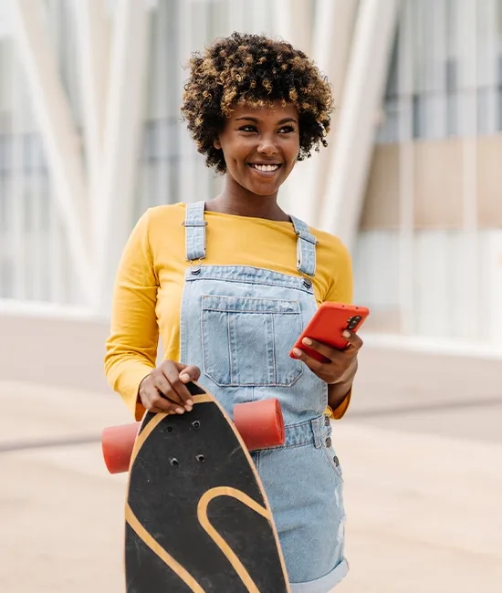 Patient recovering after SMILE eye surgery, enjoying a skateboard ride.